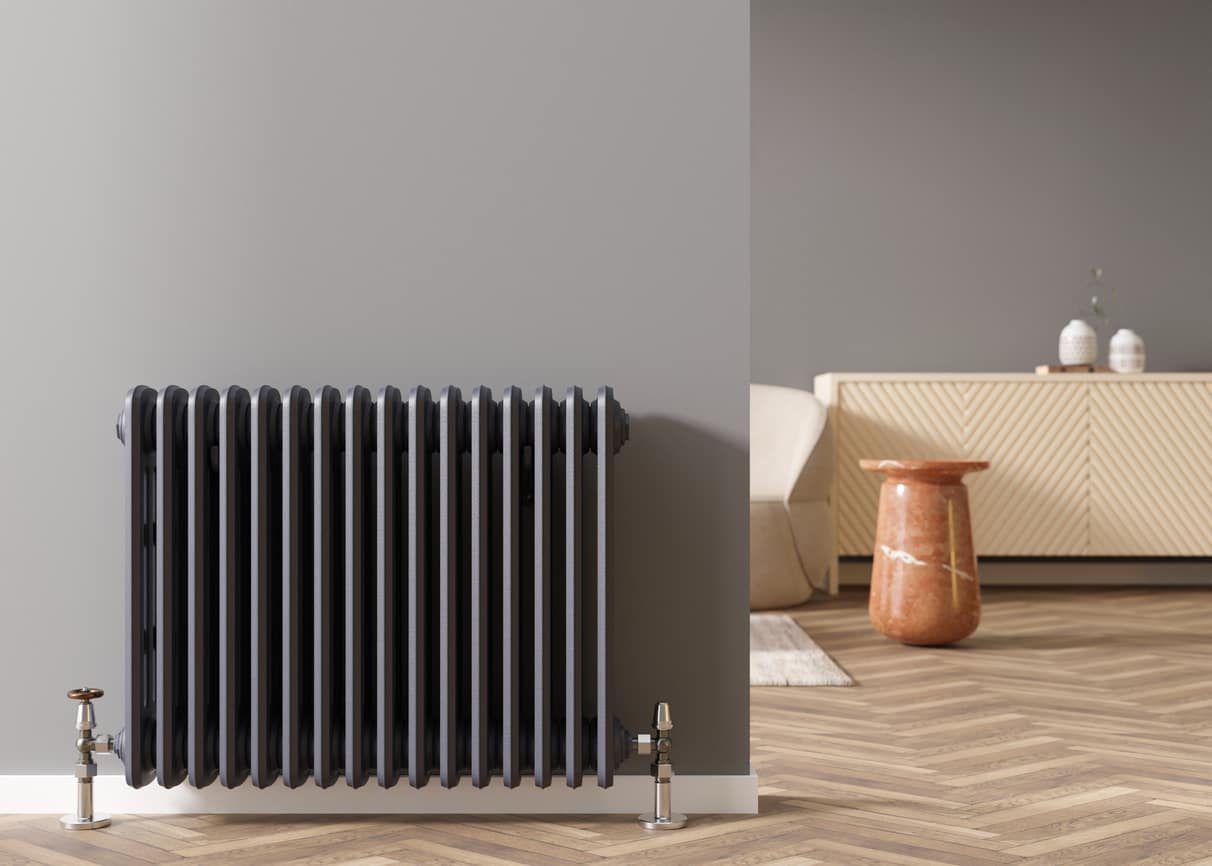 Heating radiator on gray wall in modern room. Home interior. Central heating system. Heating is getting more expensive. Energy crisis. 3D rendering. Designer Radiators